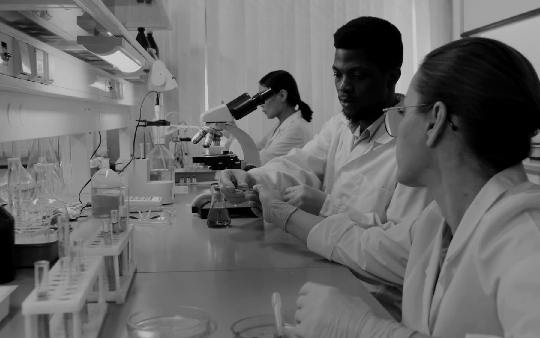 LifeVitals accredited laboratory scientists working with precision equipment.