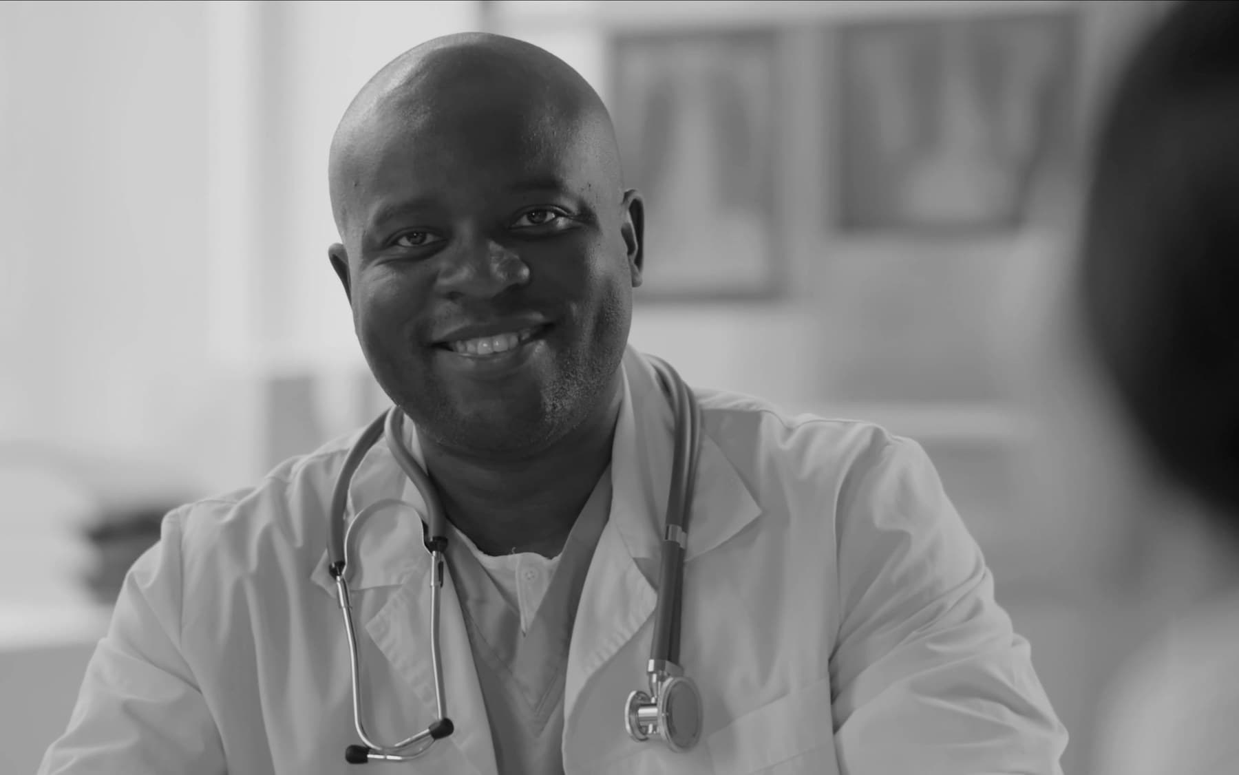 A licensed Jamaican physician ready for a virtual consultation with a LifeVitals patient.